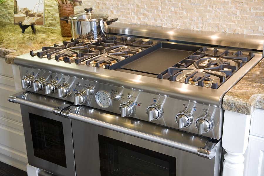 Luxury kitchen with modern gas stove close-up.